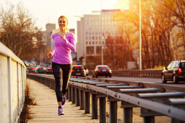 Female practicing health and wellness by jogging