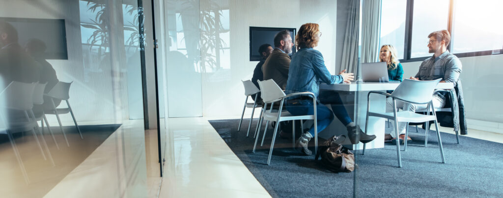 Software team meeting at a table