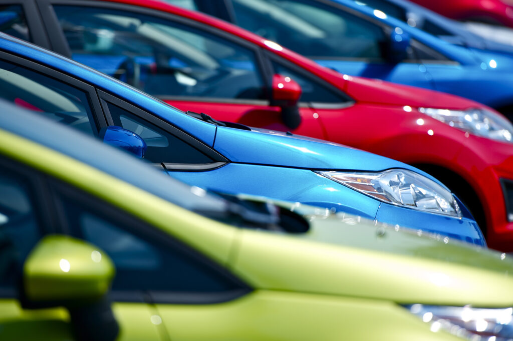 multicolored cars at an automotive dealership