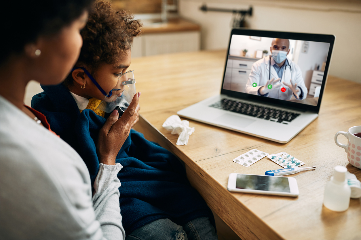 Mother and daughter having a telehealth appointment with doctor during the COVID-19 pandemic